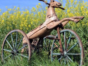 LOT 25 1880s HORSE TRICYCLE WITH WOODEN WHEELS