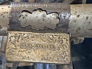 LOT 05 1890s ‘THE CYCLIST’ HANDLEBAR-MOUNTED MATCH SAFE / ASHTRAY